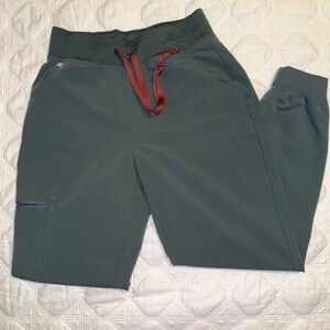 High waisted Zamora Figs uniform pants. Color is Bonsai.